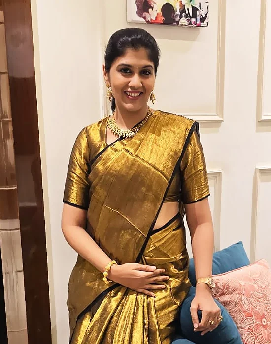 Dr. Sneha Maroo in gold saree